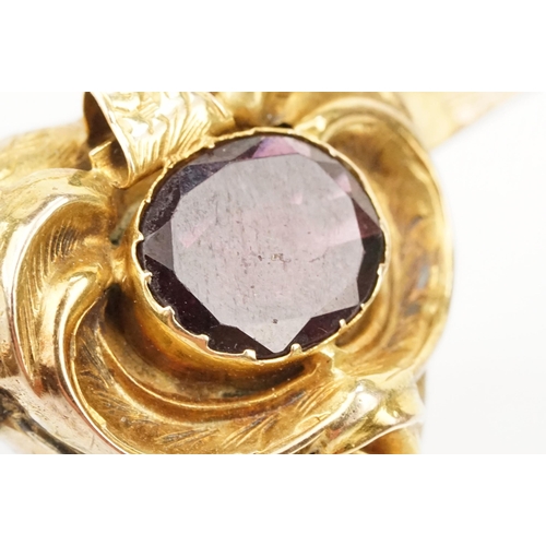 4 - 19th Century Victorian garnet bar brooch. The brooch having a padlock to centre set with an oval cut... 