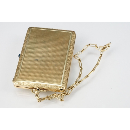 6 - Mid 20th Century 14ct gold ladies compact having an engine turned exterior with floral border and sa... 