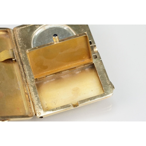 6 - Mid 20th Century 14ct gold ladies compact having an engine turned exterior with floral border and sa... 