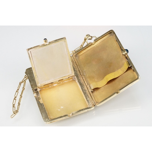 6 - Mid 20th Century 14ct gold ladies compact having an engine turned exterior with floral border and sa... 