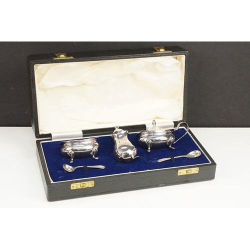 393 - Silver cruet set consisting of mustard pot, table salt and pepper pot. Hallmarked London 1972, A Chi... 