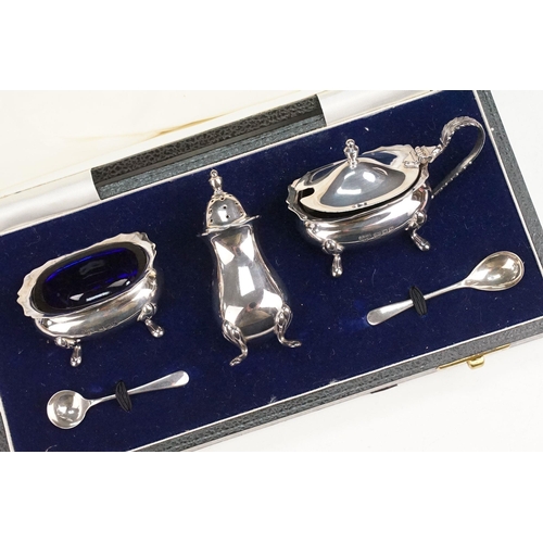 393 - Silver cruet set consisting of mustard pot, table salt and pepper pot. Hallmarked London 1972, A Chi... 