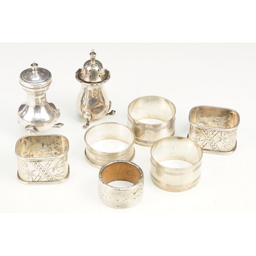 405 - Collection of silver hallmarked items to include two pepper pots, a pair of Victorian napkin rings o... 