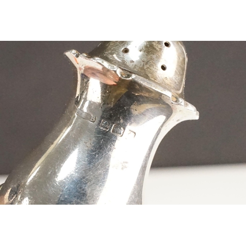 405 - Collection of silver hallmarked items to include two pepper pots, a pair of Victorian napkin rings o... 