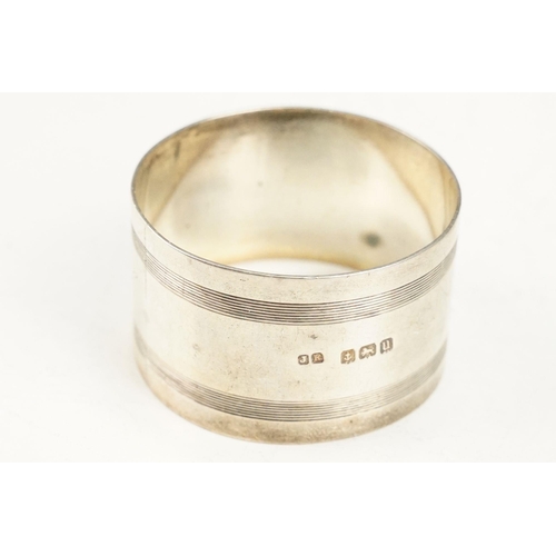 405 - Collection of silver hallmarked items to include two pepper pots, a pair of Victorian napkin rings o... 