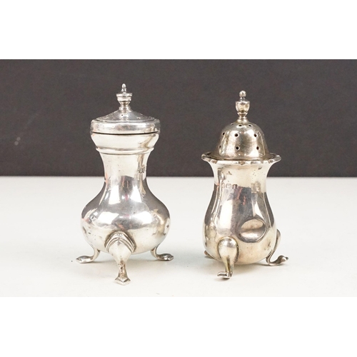 405 - Collection of silver hallmarked items to include two pepper pots, a pair of Victorian napkin rings o... 