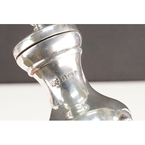 405 - Collection of silver hallmarked items to include two pepper pots, a pair of Victorian napkin rings o... 