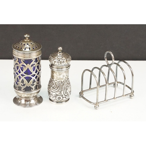 402 - Group of silver to include a blue glass lined pepper pot (hallmarked Exeter 1847), silver repousse p... 