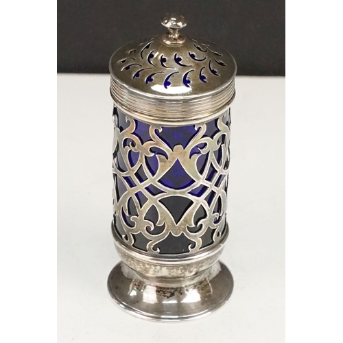 402 - Group of silver to include a blue glass lined pepper pot (hallmarked Exeter 1847), silver repousse p... 