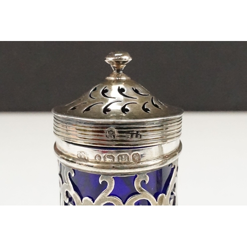 402 - Group of silver to include a blue glass lined pepper pot (hallmarked Exeter 1847), silver repousse p... 