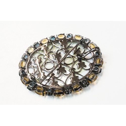 103A - A hand painted Fedoskino miniature brooch from the Didaj collection, black Rhodium and 18k gold over... 