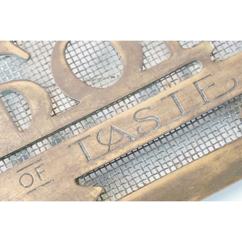 139A - 20th century Montague Burton 'The Tailor of Taste' brass shop sign door grill, H 20.5cm W 61.5cm