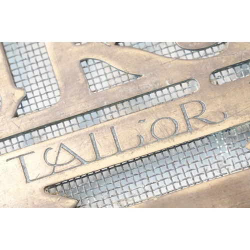 139A - 20th century Montague Burton 'The Tailor of Taste' brass shop sign door grill, H 20.5cm W 61.5cm