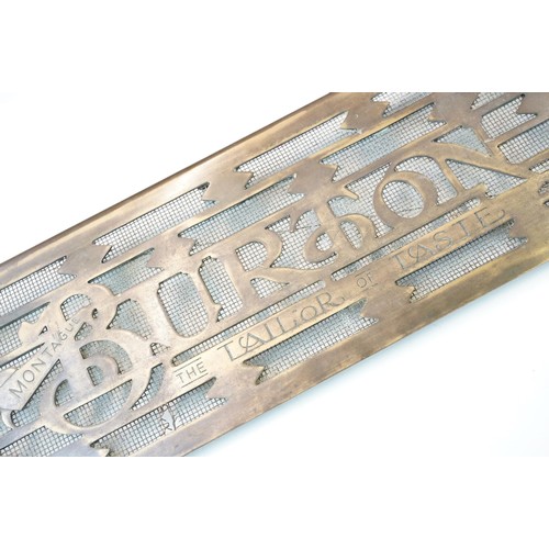 139A - 20th century Montague Burton 'The Tailor of Taste' brass shop sign door grill, H 20.5cm W 61.5cm