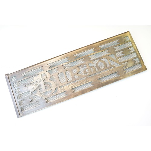 139A - 20th century Montague Burton 'The Tailor of Taste' brass shop sign door grill, H 20.5cm W 61.5cm