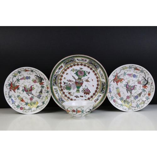 13 - Pair of Chinese famille rose shallow bowls and a matching tea bowl, each decorated with butterflies ... 