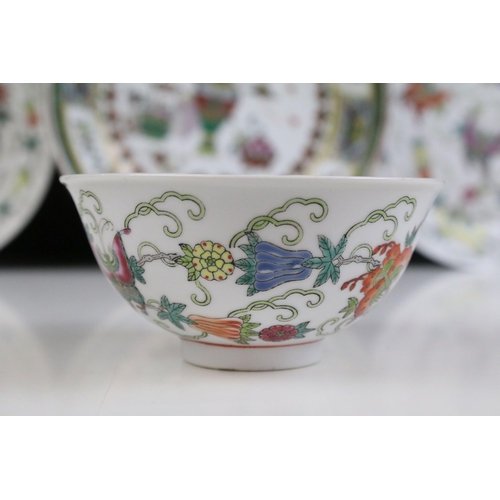 13 - Pair of Chinese famille rose shallow bowls and a matching tea bowl, each decorated with butterflies ... 