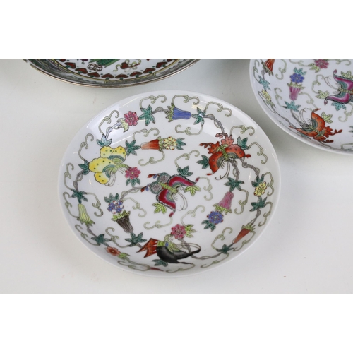 13 - Pair of Chinese famille rose shallow bowls and a matching tea bowl, each decorated with butterflies ... 