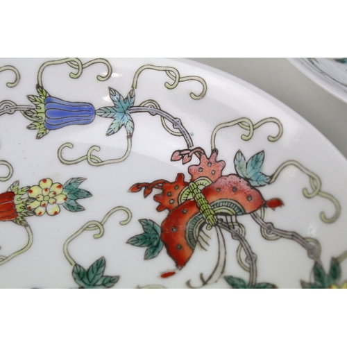 13 - Pair of Chinese famille rose shallow bowls and a matching tea bowl, each decorated with butterflies ... 