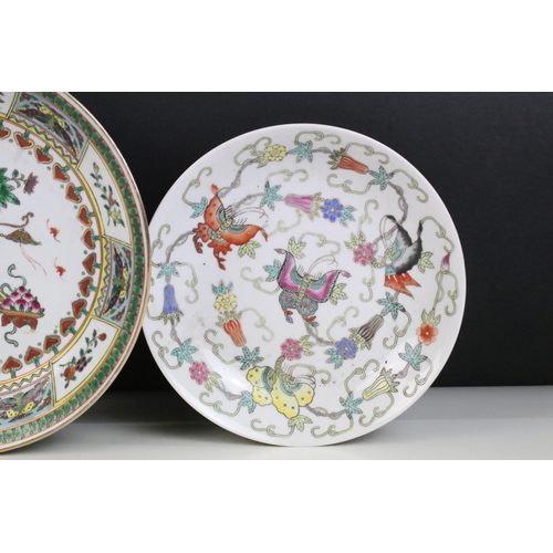 13 - Pair of Chinese famille rose shallow bowls and a matching tea bowl, each decorated with butterflies ... 