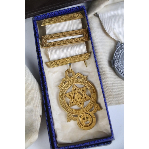 131 - A collection of masonic collectables to include jewels, sashes, books and associated regalia.