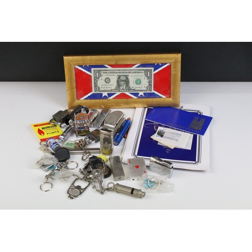 133 - A small group of mixed collectables to include stamps, a collection of pocket lighters and a framed ... 