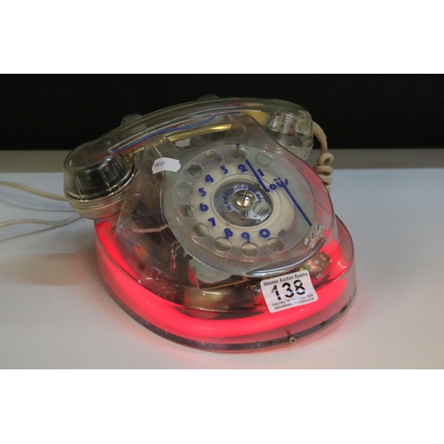 138 - A vintage / Retro analogue telephone with clear encasement and neon light.