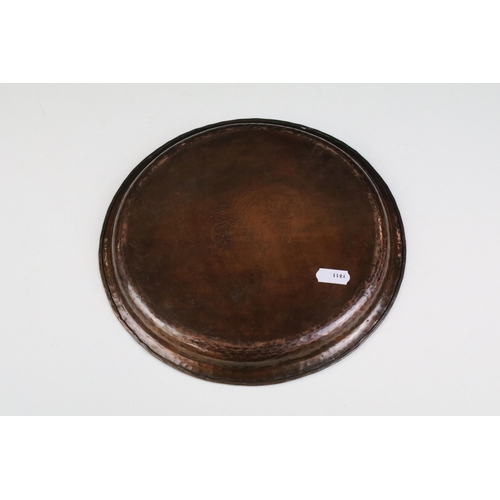 158 - Hugh Wallace copper tray plate with berry and foliage inlay and hammered edge, diameter 25cm