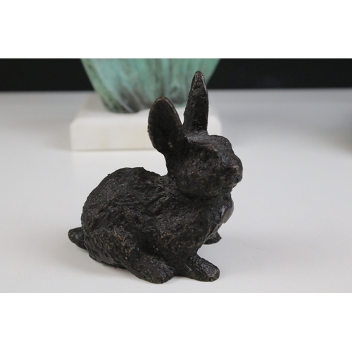 166 - Bronze figure of a rabbit, 10.5cm high, a bronzed star gazing stylised face mounted on marble base, ... 