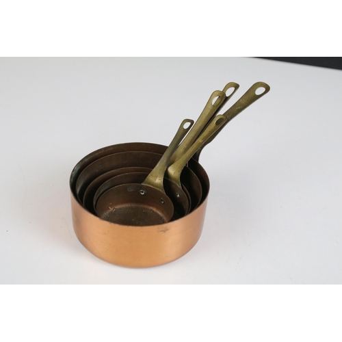 175A - Set of five small copper graduating saucepans with brass handles