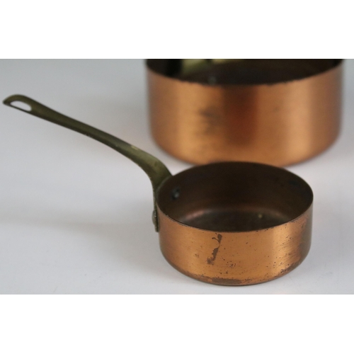 175A - Set of five small copper graduating saucepans with brass handles