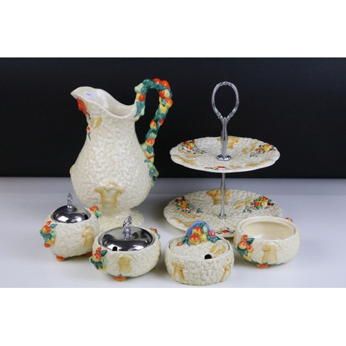 18 - Clarice Cliff 'Celtic Harvest' collection to include double tired cake stand, three preserve pots (t... 