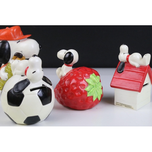 20 - 20th century vintage ceramic Snoopy money box figurines to include Snoopy on giant strawberry, Snoop... 