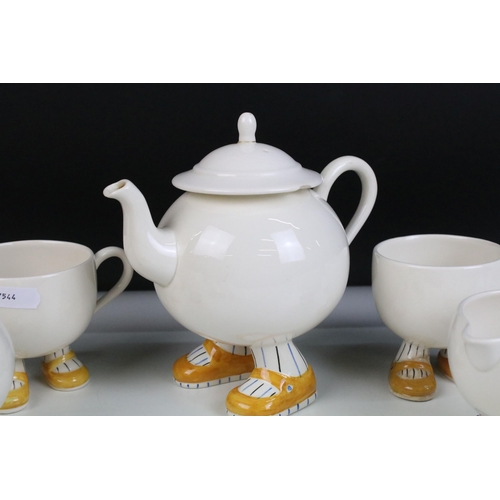 27 - Carlton ware 'Walking Ware' part breakfast set to include four 'footed' cups, tea pot, milk jug, sug... 