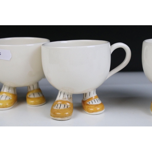 27 - Carlton ware 'Walking Ware' part breakfast set to include four 'footed' cups, tea pot, milk jug, sug... 