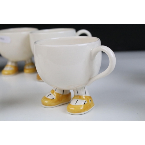 27 - Carlton ware 'Walking Ware' part breakfast set to include four 'footed' cups, tea pot, milk jug, sug... 