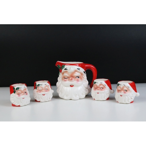 4 - 20th century ceramic Santa jug and a set of four matching beakers