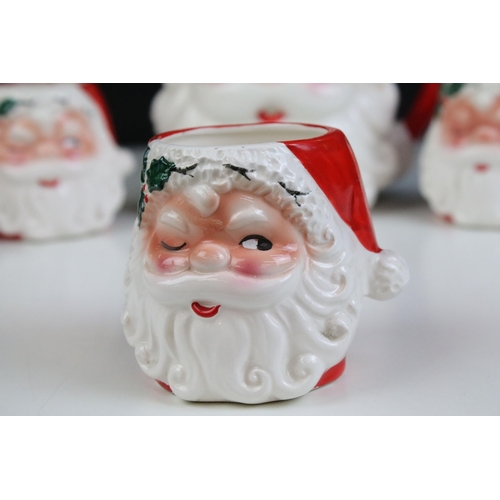 4 - 20th century ceramic Santa jug and a set of four matching beakers