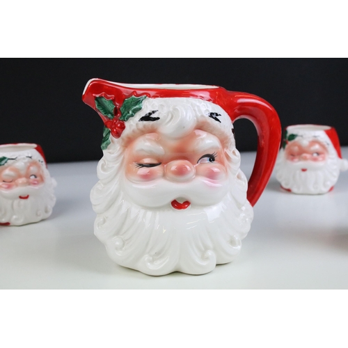 4 - 20th century ceramic Santa jug and a set of four matching beakers