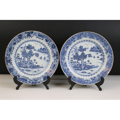 34 - Pair of blue and white Chinese decorative landscape plates on stands, diameter 23cm together with sm... 