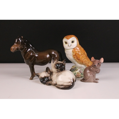 37 - Group of four Beswick figurines to include Shetland pony, Owl 2026,  Siamese kittens 1296 and mouse ... 