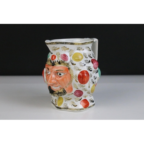 39 - 19th century hand painted Satyr jug of grinning bearded face man with leaves and raised area decorat... 