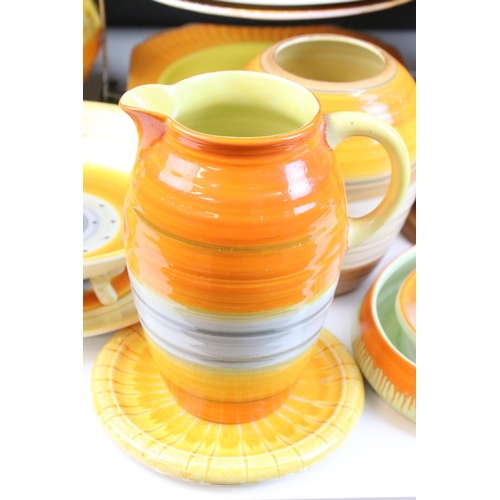 51 - Collection of Shelley Harmony ware in varying sunset tones of orange and yellow, to include jardinie... 