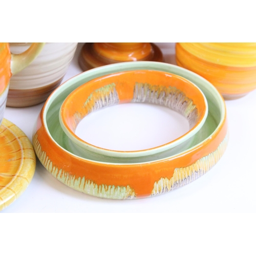 51 - Collection of Shelley Harmony ware in varying sunset tones of orange and yellow, to include jardinie... 