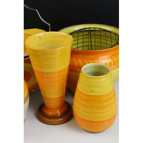 51 - Collection of Shelley Harmony ware in varying sunset tones of orange and yellow, to include jardinie... 