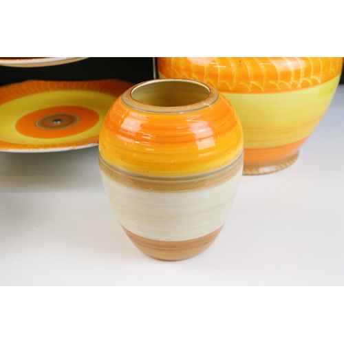 51 - Collection of Shelley Harmony ware in varying sunset tones of orange and yellow, to include jardinie... 