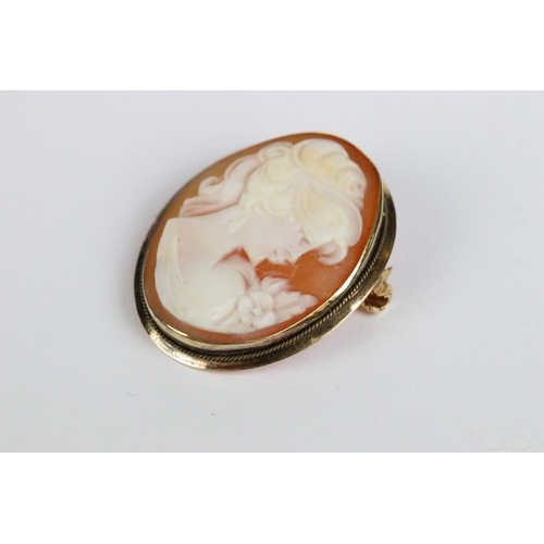 103 - A 9ct gold cameo brooch together with a pair of 9ct gold earrings, 18ct gold cameo brooch and a yell... 