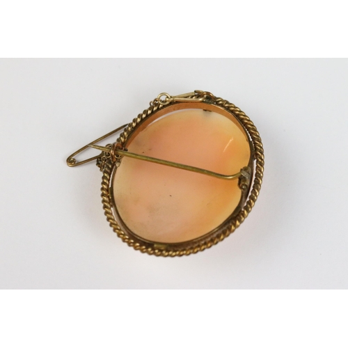 103 - A 9ct gold cameo brooch together with a pair of 9ct gold earrings, 18ct gold cameo brooch and a yell... 