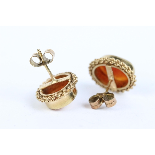 103 - A 9ct gold cameo brooch together with a pair of 9ct gold earrings, 18ct gold cameo brooch and a yell... 