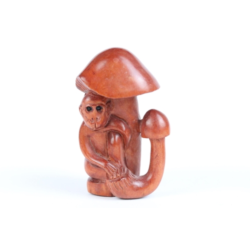 104 - Two carved wood netsuke figures to include bird with baby monkey (signed) and a monkey sat in mushro... 